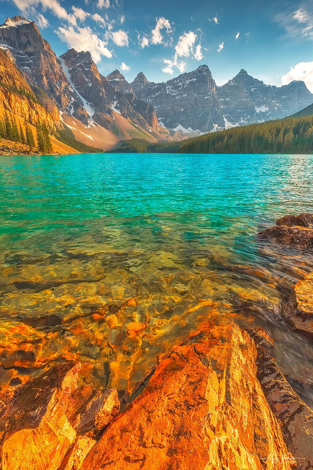 Aqua blue waters of  glacially-fed Moraine Lake is a feast to eyes  any time of the day . This image was taken during a Mid day...